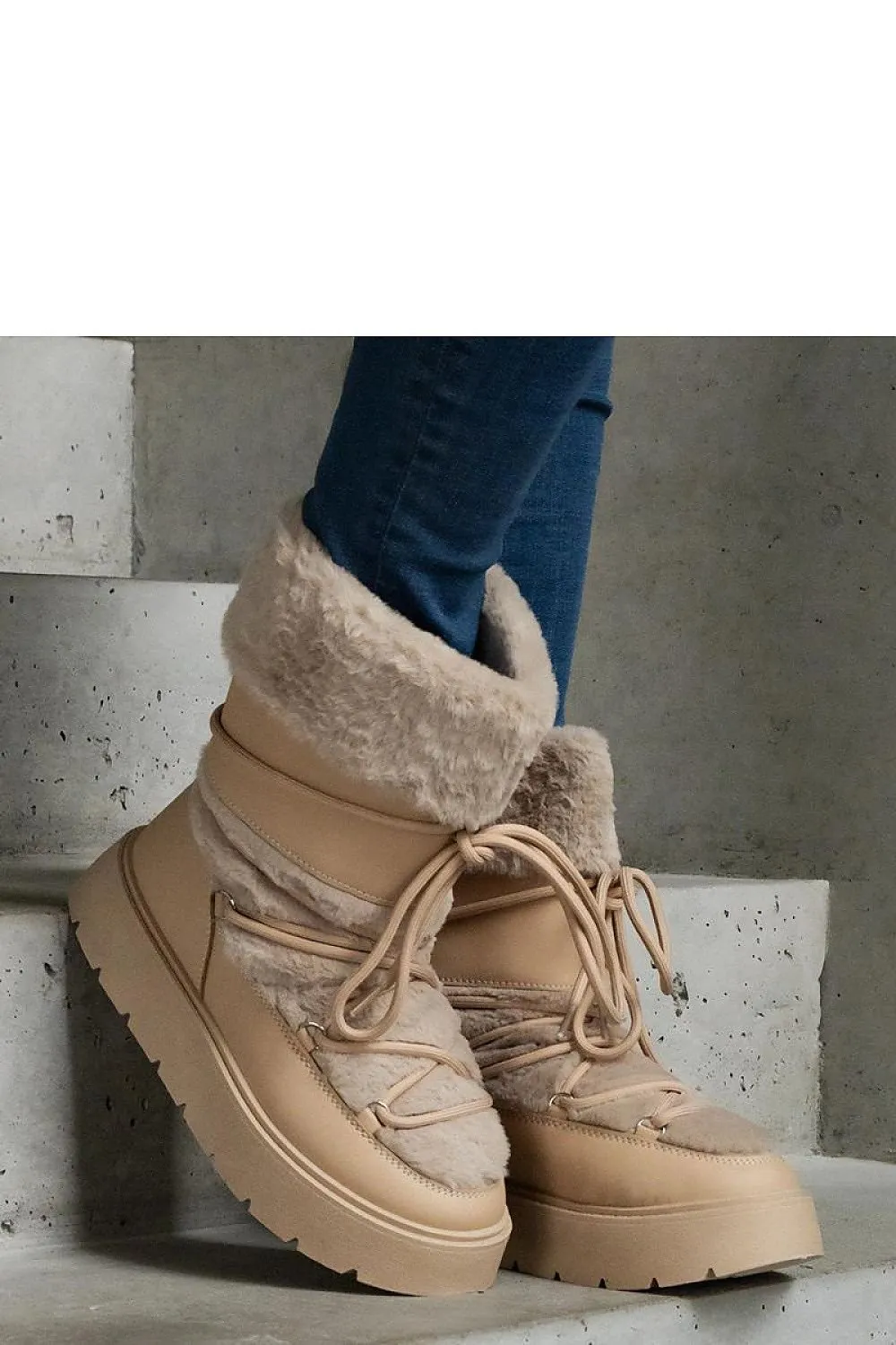 Black lined snow boots laced with fur