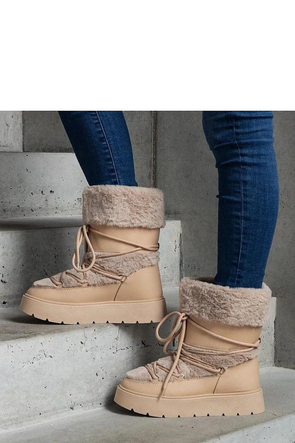 Black lined snow boots laced with fur