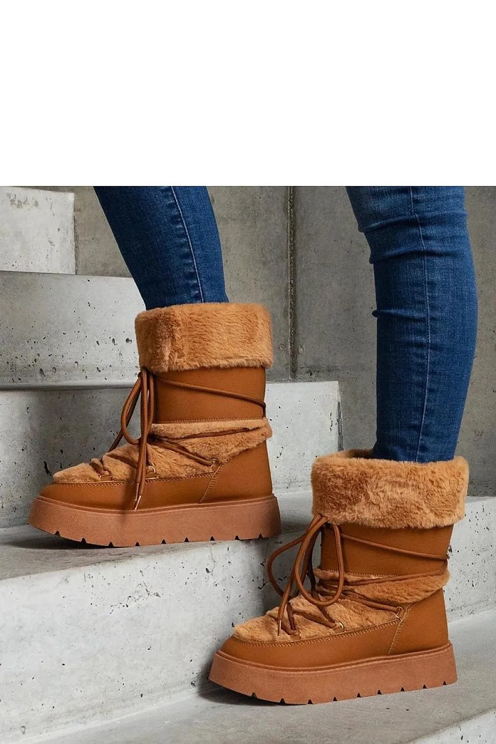 Black lined snow boots laced with fur