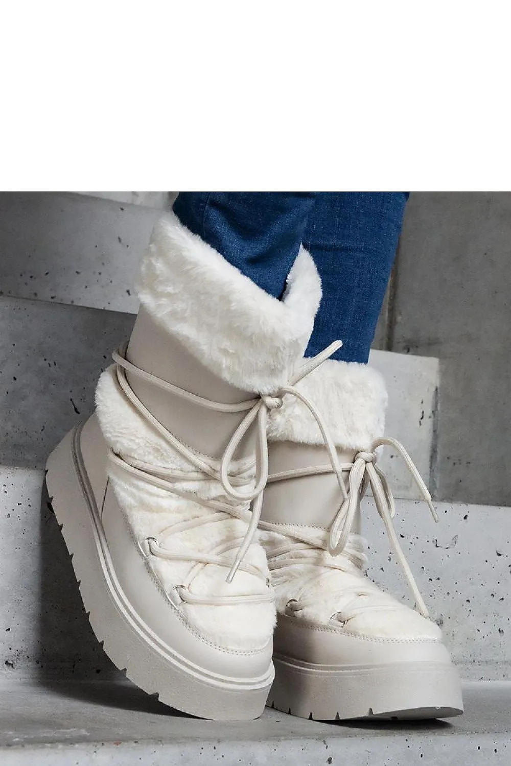 Black lined snow boots laced with fur