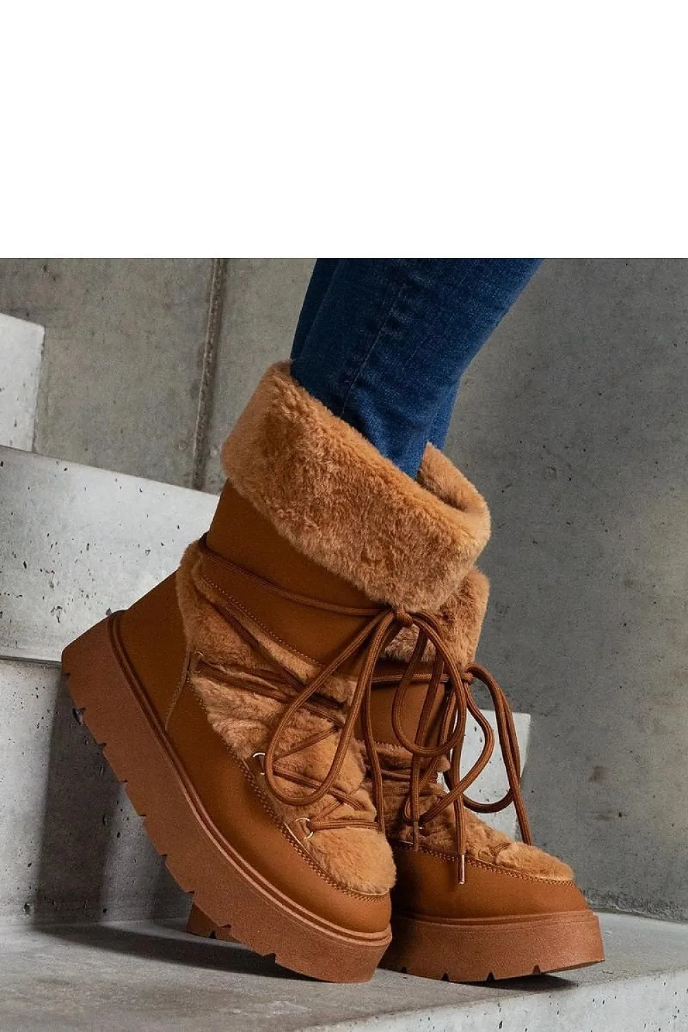 Black lined snow boots laced with fur
