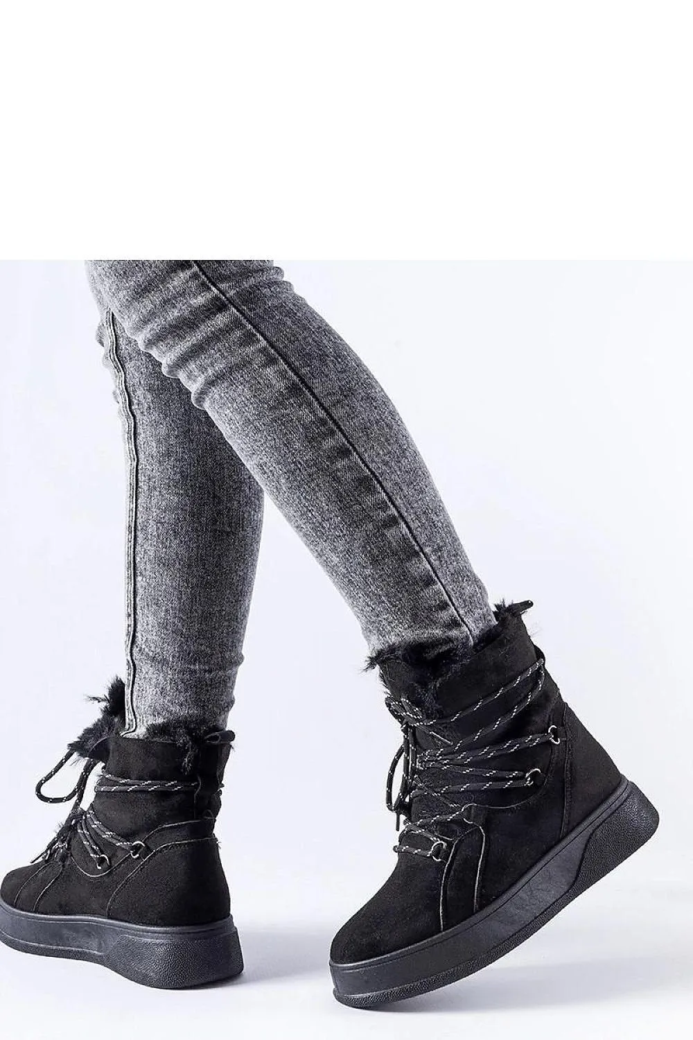 Black snow boots on the Rancourt platform