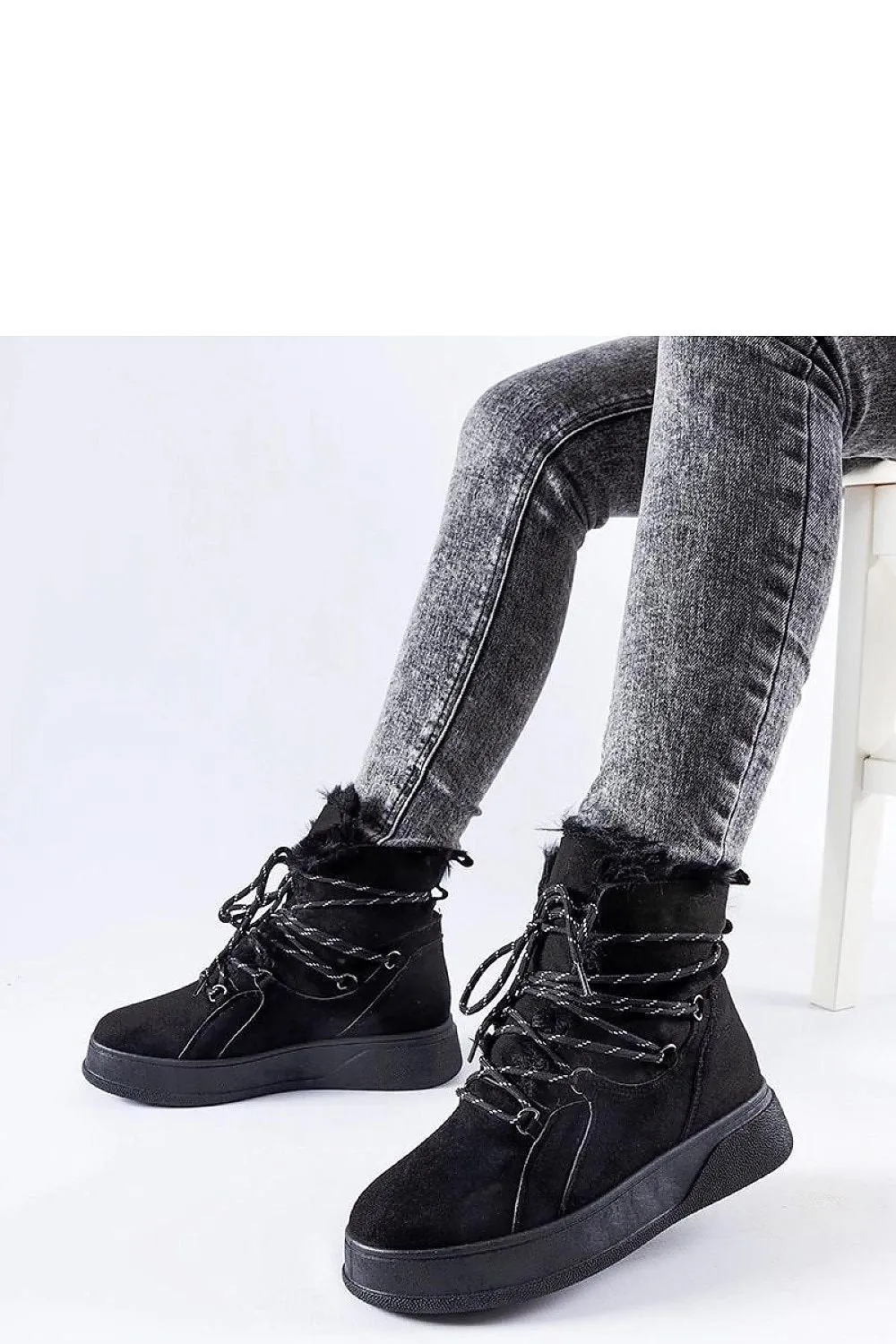 Black snow boots on the Rancourt platform