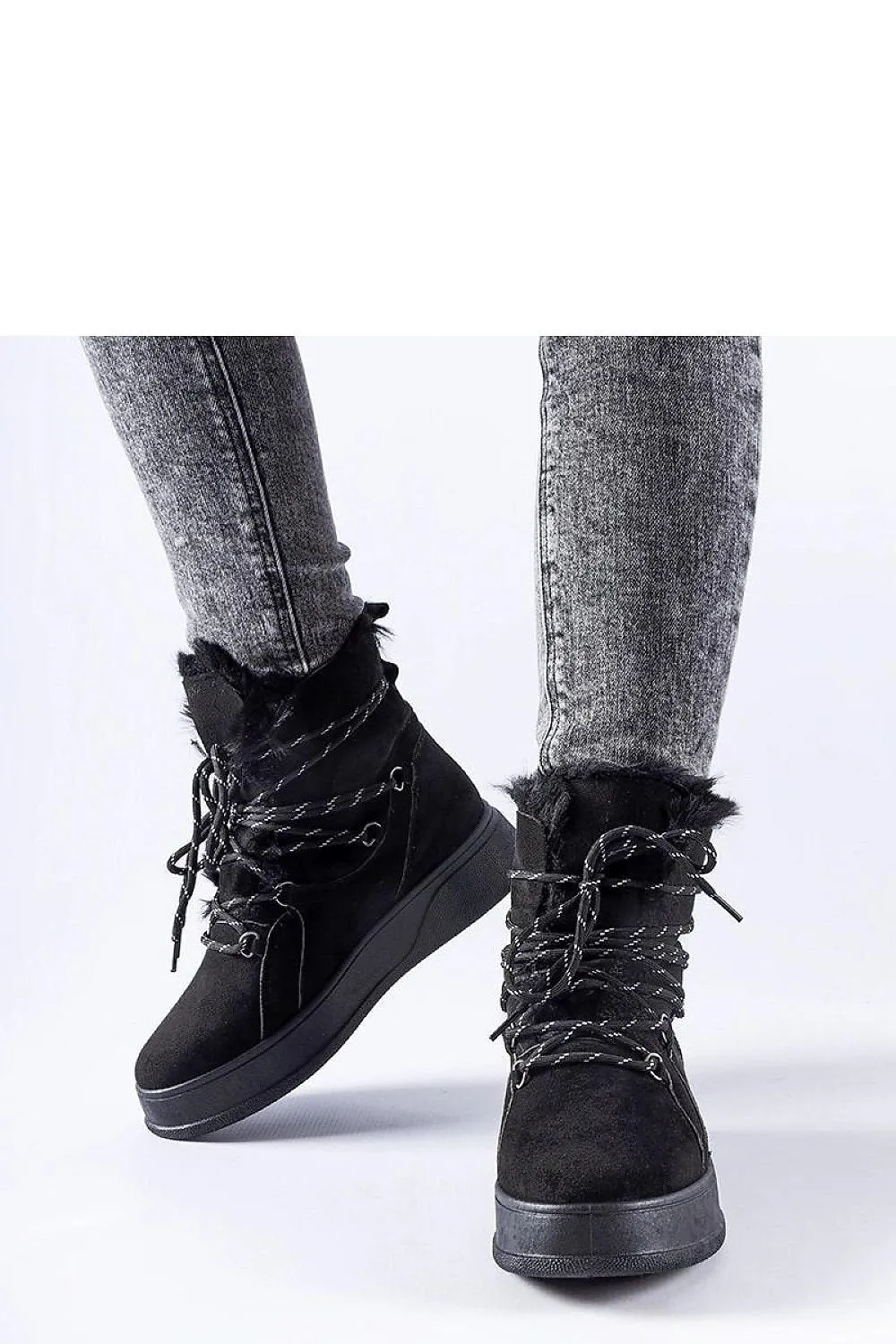 Black snow boots on the Rancourt platform