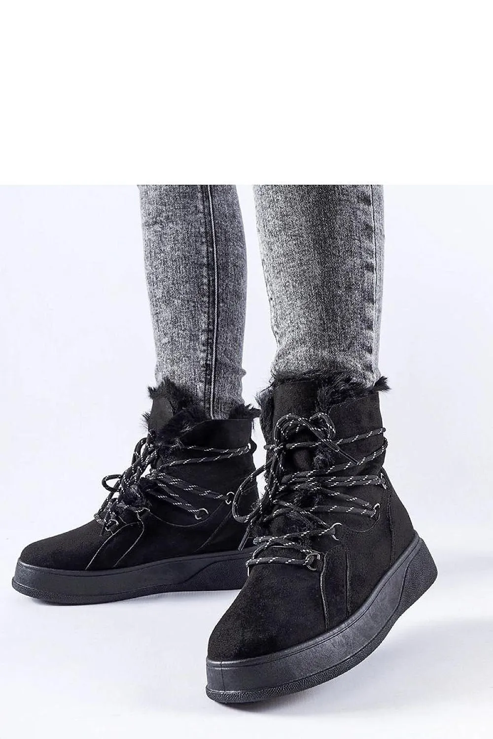 Black snow boots on the Rancourt platform
